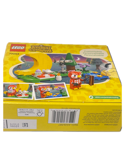 The back of a yellow LEGO toy box, showing product details, instructions, a barcode, and colorful illustrations of a building set on a white background.