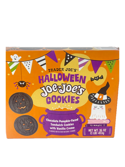 Trader Joe's Halloween Joe's Cookies box, featuring an orange and purple design with illustrations of a witch, spider, and candy corn, and showing two decorated cookies on the front.