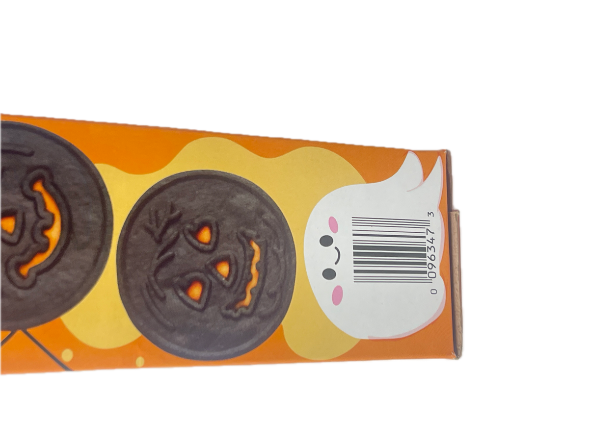 A close-up of a Halloween-themed snack box showing two jack-o'-lantern cookies on an orange and yellow background with a white ghost illustration.