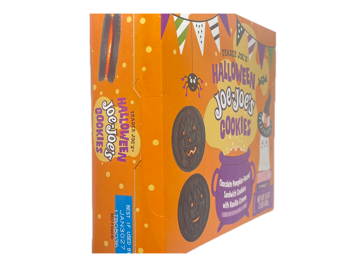 A box of Halloween Jolly Cookies by Travis Jolly, featuring an orange design with illustrations of jack-o'-lanterns, a spider, and candy corn, along with a blue 'Best If Used By' sticker.