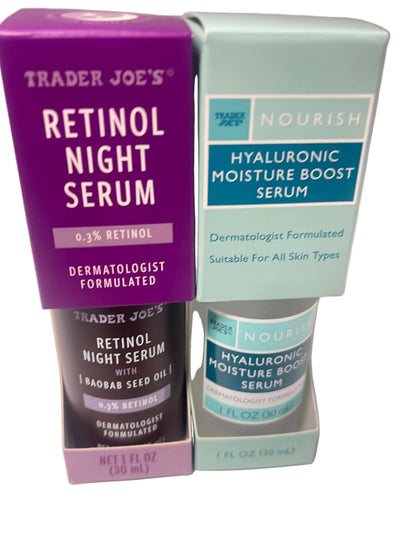 Two Trader Joe's skincare products in their retail packaging: a purple box of Retinol Night Serum and a mint green box of Hyaluronic Moisture Boost Serum, with the bottles partially visible below.