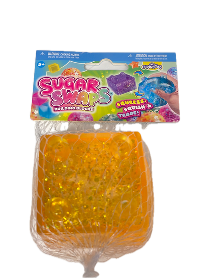 A package of Sugar Swabs Swirling Gels shown next to a single orange gel swab sealed in a clear mesh bag, on a plain white background.