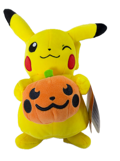 A yellow Pikachu plush toy lying down and holding an orange pumpkin with a black stitched face. The plush has black-tipped ears and tail tip, red cheeks, and a hangtag attached near the top right.