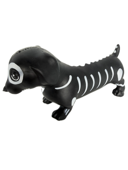 A SQUISHY black and white skeleton dog toy floating vertically against a solid white background.