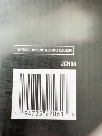 Close-up of the back of a black product box showing a barcode, the text 'CONTENTS: 1 DINOSAUR (ASSEMBLY REQUIRED)', and the code 'JCH08'.