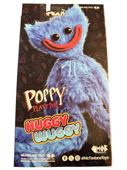 McFarlane Toys Poppy Playtime Huggy Wuggy toy packaging box featuring a large blue furry character with a red smile on a dark patterned background.