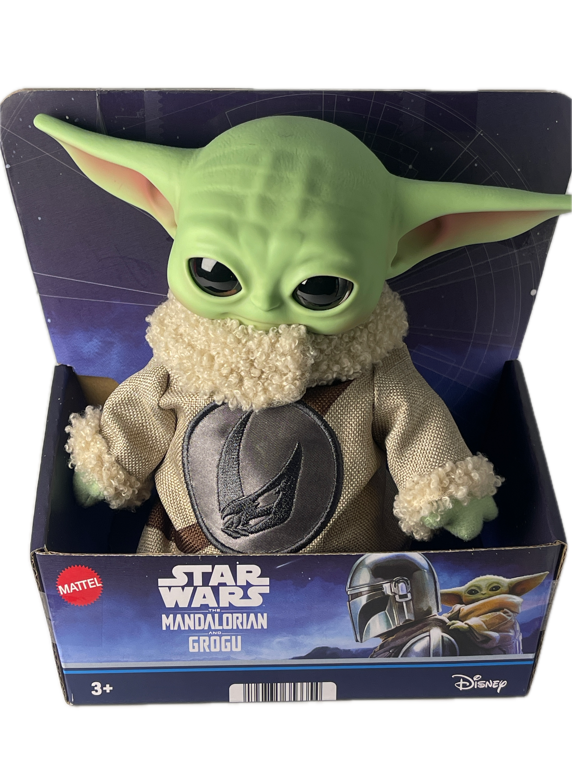 Green toy figure of a character from 'The Mandalorian' in packaging with 'Star Wars' branding.