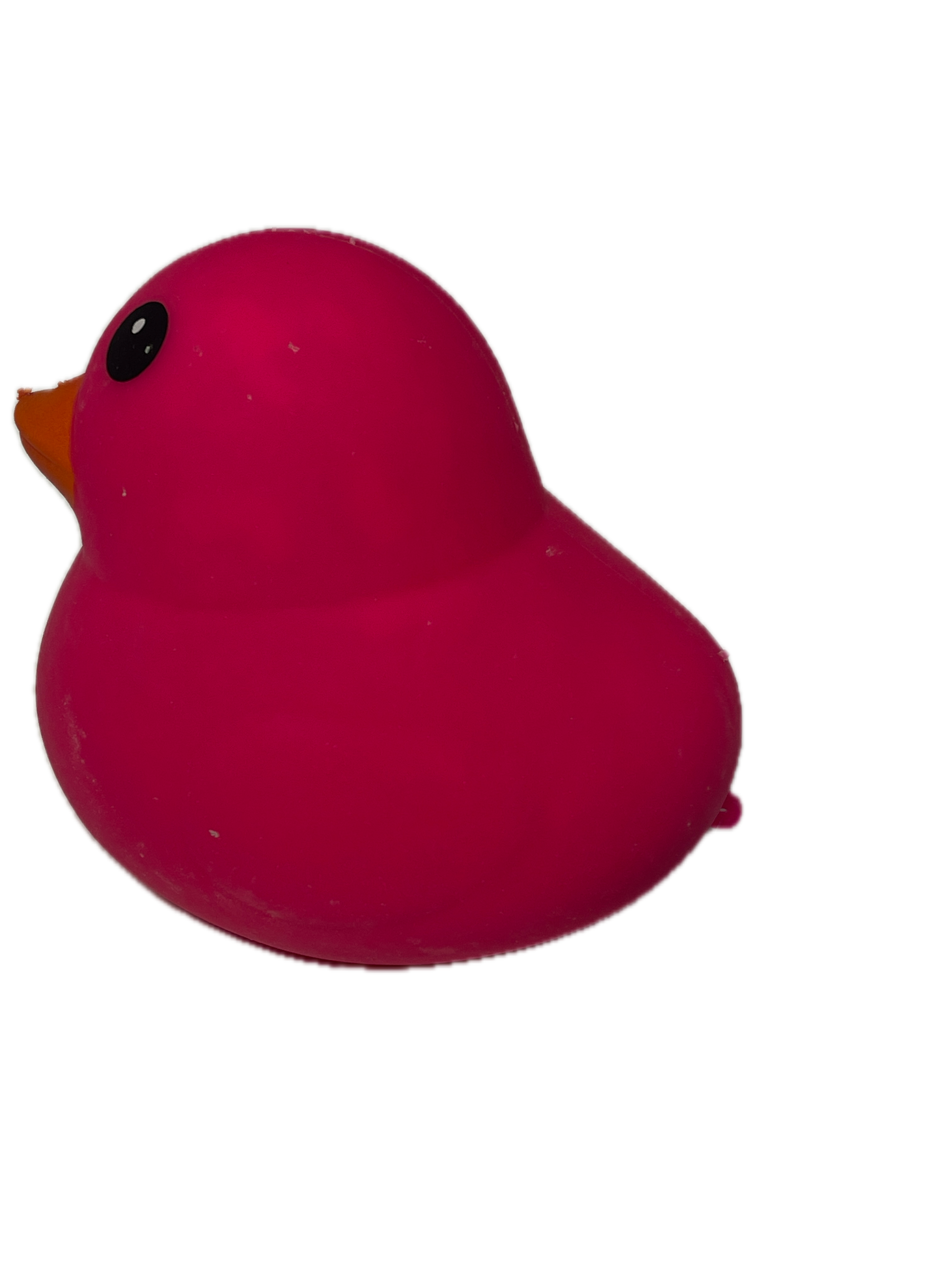 Pink heart-shaped object with a black dot on a white background
