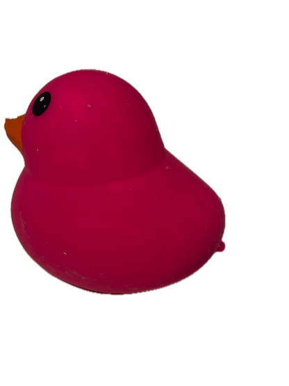 Pink heart-shaped object with a black dot on a white background