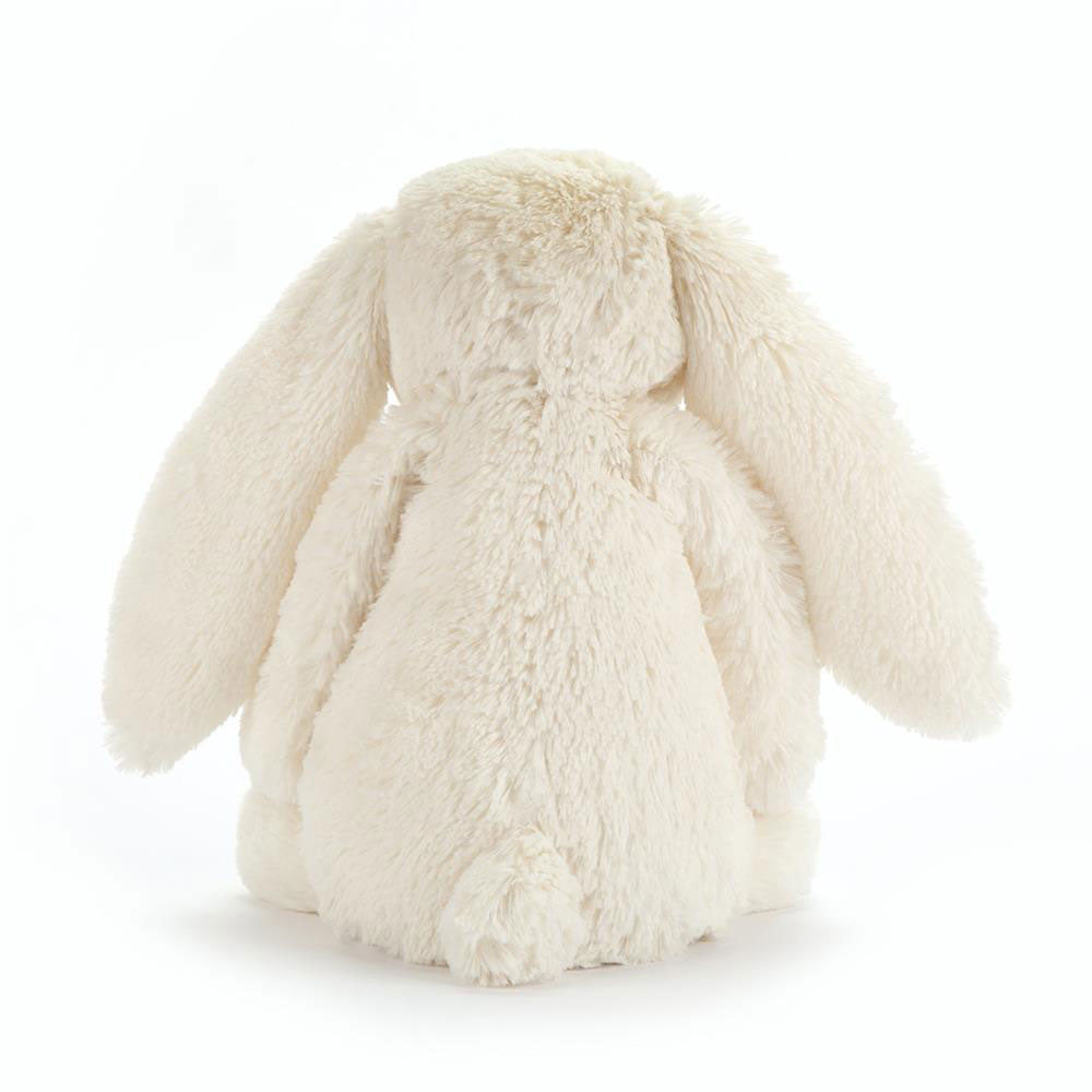 Fluffy white bunny toy on a white background