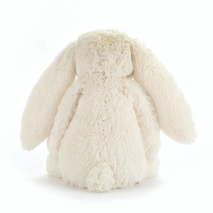 Fluffy white bunny toy on a white background