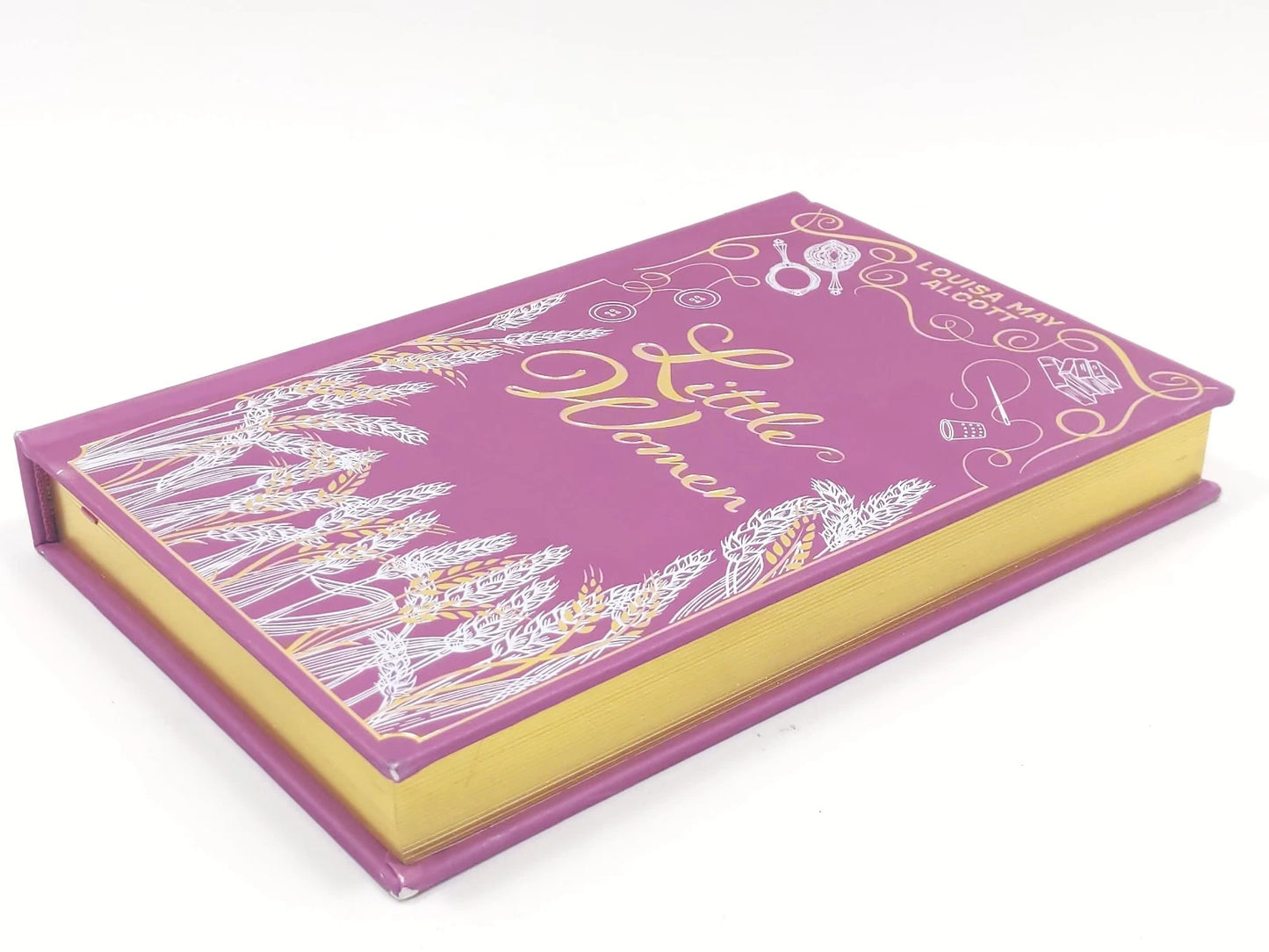Purple book with 'Little Women' on a white background