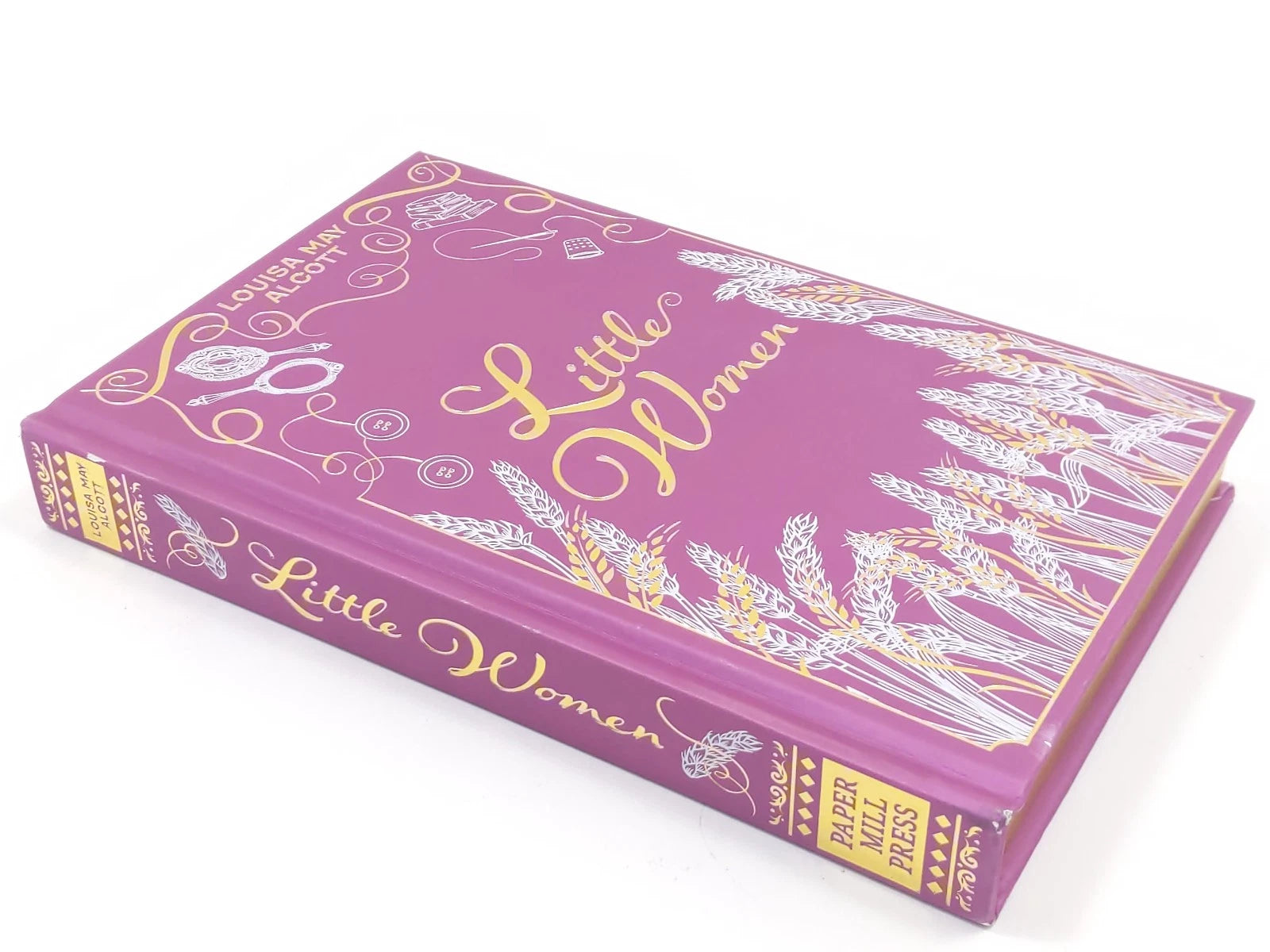 Book titled 'Little Women' with decorative cover on a white background