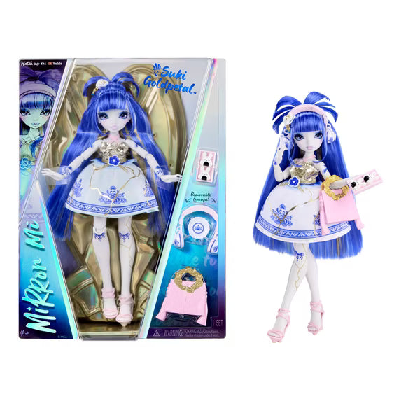 Mirror Me! Suki Golapeel doll shown both inside its retail packaging and standing outside it on a plain white background. The doll has long blue hair, a white and blue dress, and pink accessories.