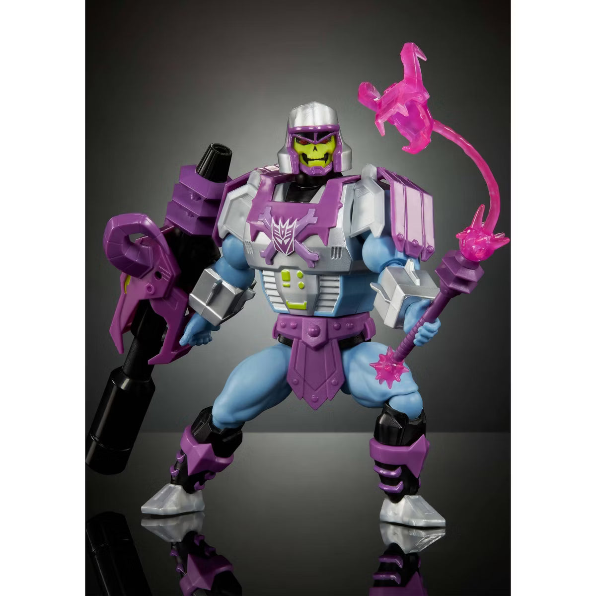 Toy figure with purple and gray armor holding a pink weapon on a reflective surface.