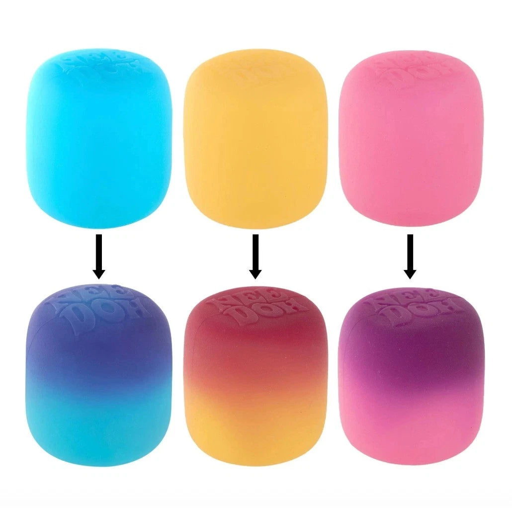 Set of colorful foam dice with gradient effects on a white background
