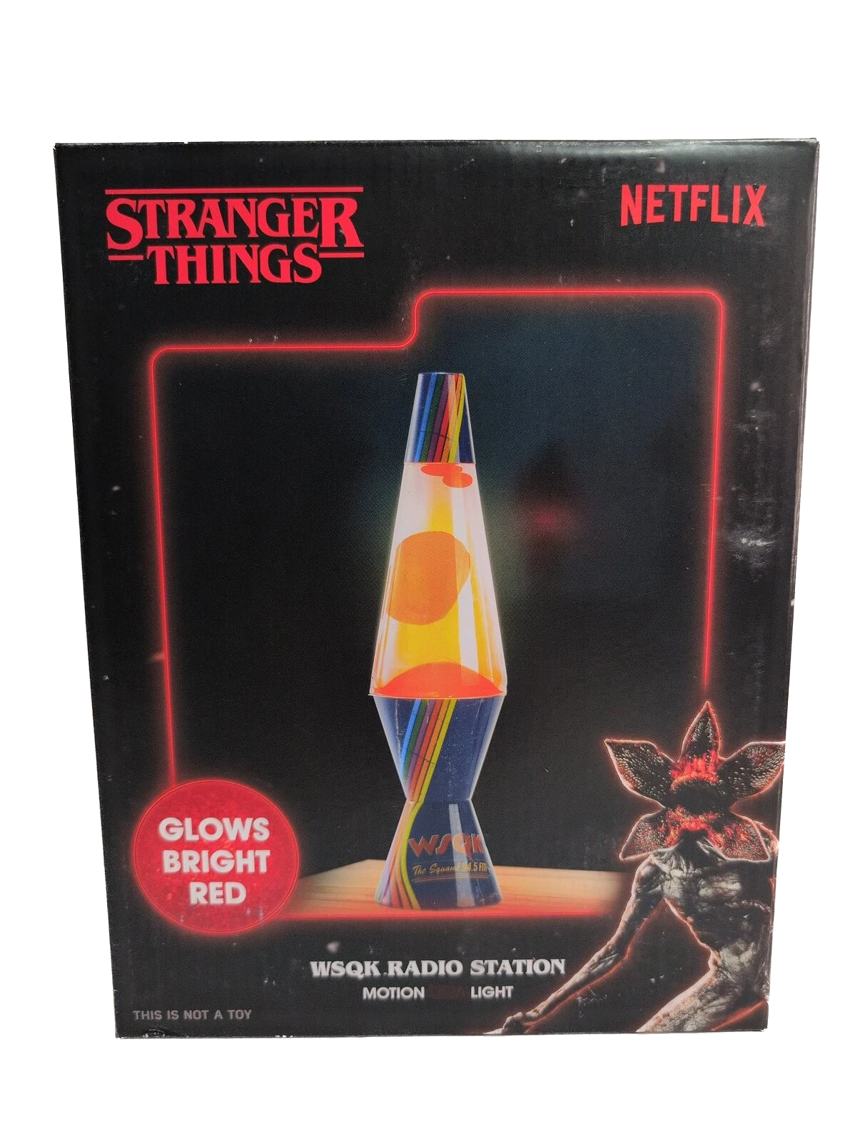 Stranger Things-themed lava lamp packaging with red neon outline and character illustration.