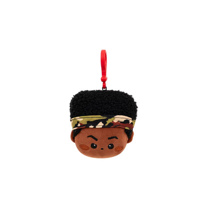Plush keychain with a person's face, black hair, and a colorful headband on a white background.