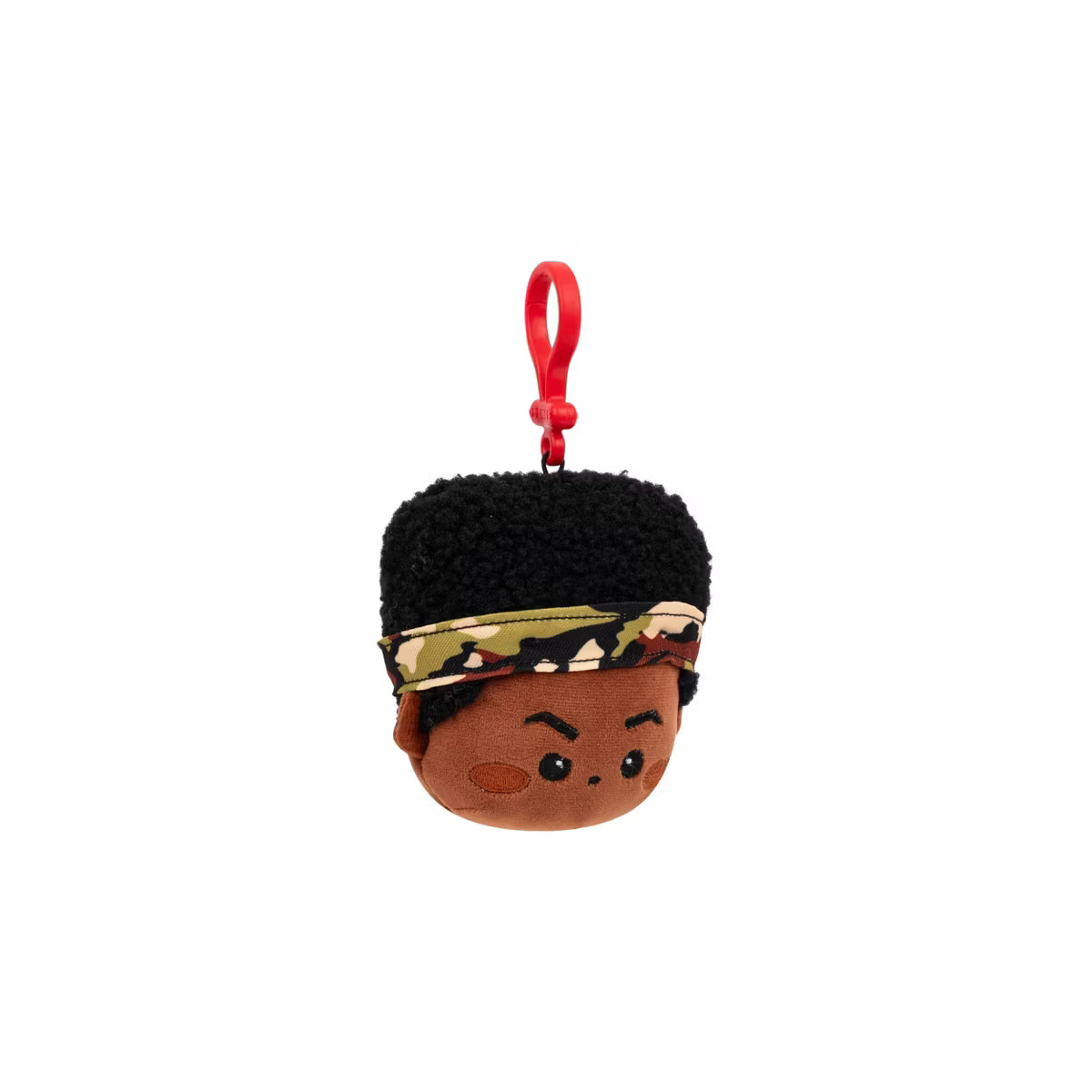 Plush keychain with a stylized face and camouflage bandana on a white background