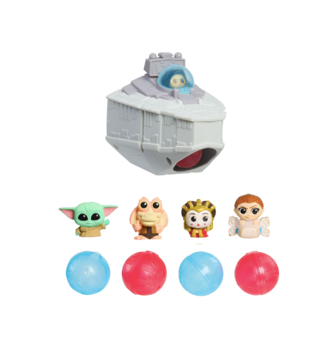 Toy set with a spaceship, small figures, and colorful balls on a white background