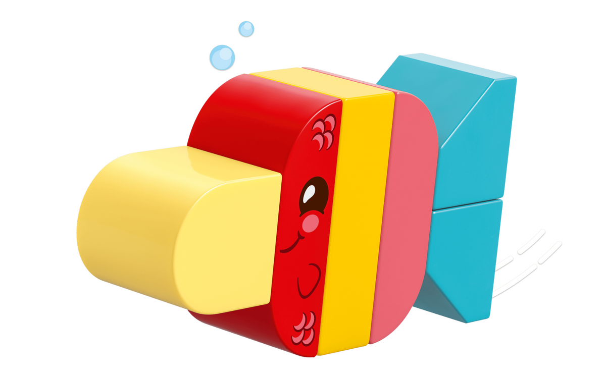 A colorful 3D-rendered toy-like object with a red, yellow, pink, and light blue geometric design, shown on a plain white background with small floating bubbles.