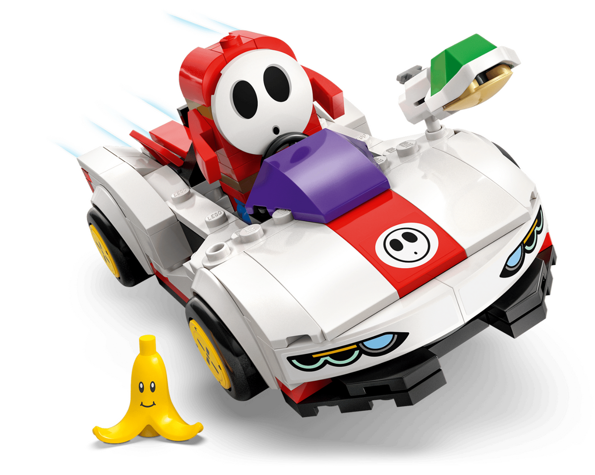 LEGO City Super Mario Kart racing car set featuring a white, red, and purple race car with a Super Mario character driver, accompanied by a yellow banana coin on a clean white background.