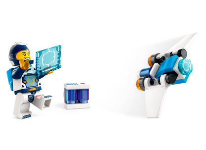 LEGO City astronaut minifigure holding a blue holographic screen, shown next to a small blue and white storage container and a white and blue space capsule on a clean white background.