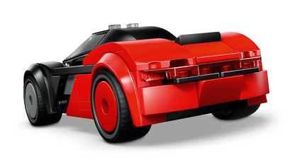 A red and black toy sports car built from interlocking blocks, shown from a three-quarters rear angle on a clean white background.