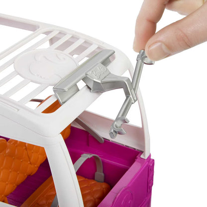 Close-up of a toy kitchen set with a hand holding a tool, on a white background.