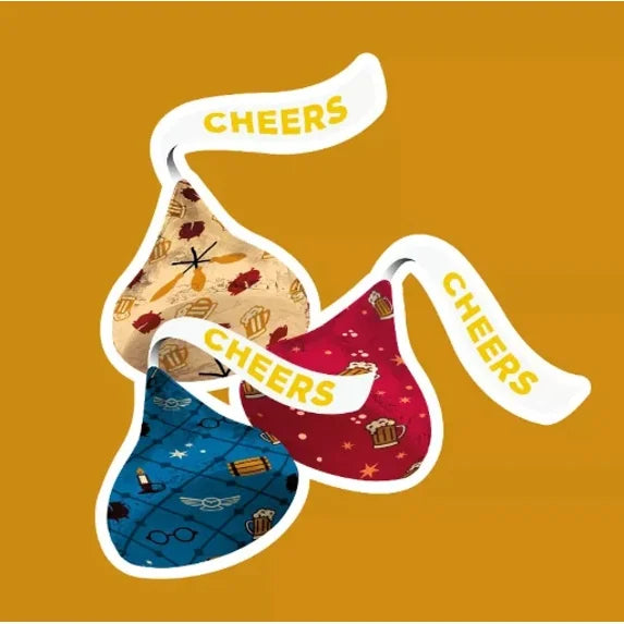 Four colorful beer bottles with 'Cheers' text on a mustard yellow background