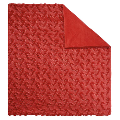 Holiday embroidered faux fur throw, Candy Cane style, laid flat with corner folded