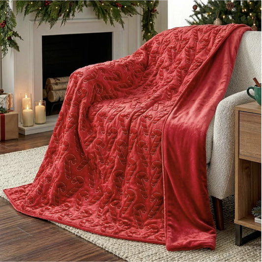 Holiday embroidered faux fur throw, Candy Cane style, draped over a chair