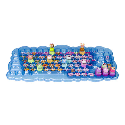 A blue plastic toy tray filled with small colorful animal figures, photographed on a plain white background.