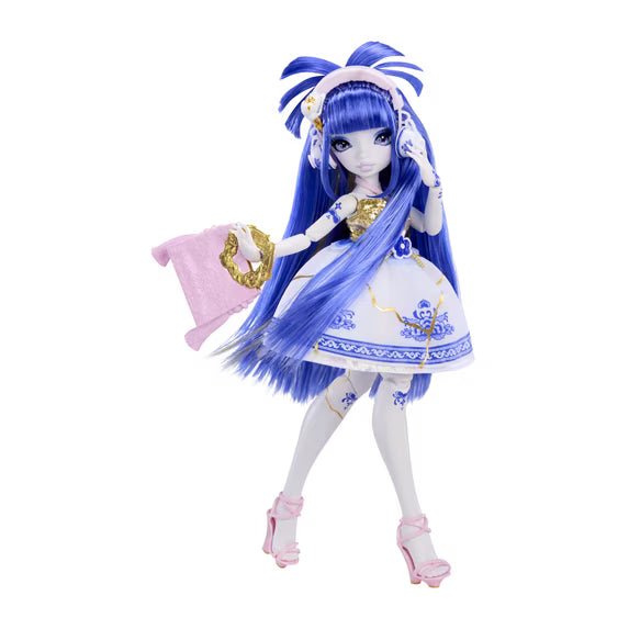 A fashion doll with long blue hair, wearing a white and blue patterned dress, white thigh-high stockings, and pink high heels, holding a pink garment against a plain white background.