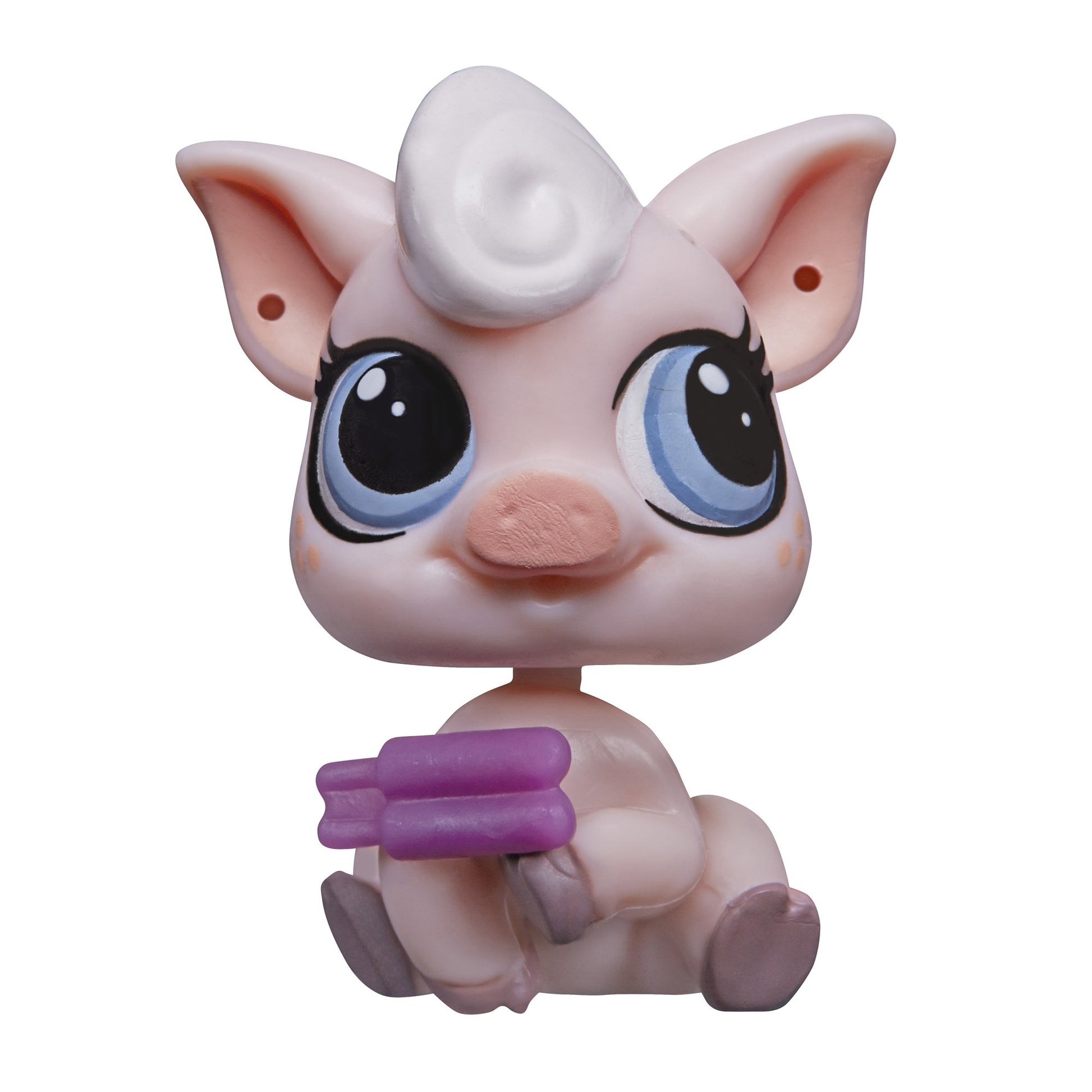 Toy figure of a pink creature with large eyes and purple accents on a white background