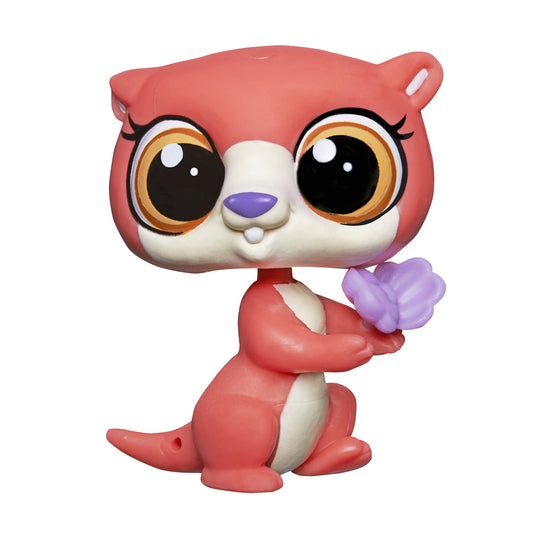 Toy figure of a pink animal with large eyes holding a purple flower on a white background