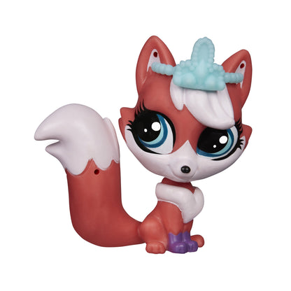 Toy fox figure with a blue hat on a white background