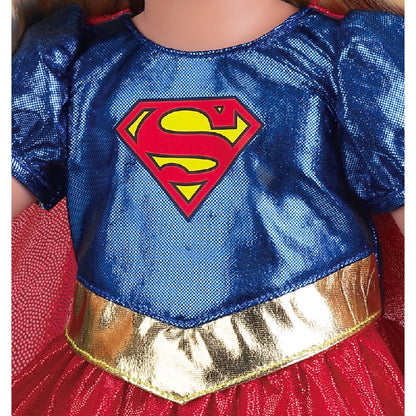 Close-up of a blue sequined costume top with a red and yellow Superman-style chest emblem, paired with a red skirt and shiny gold waistband.