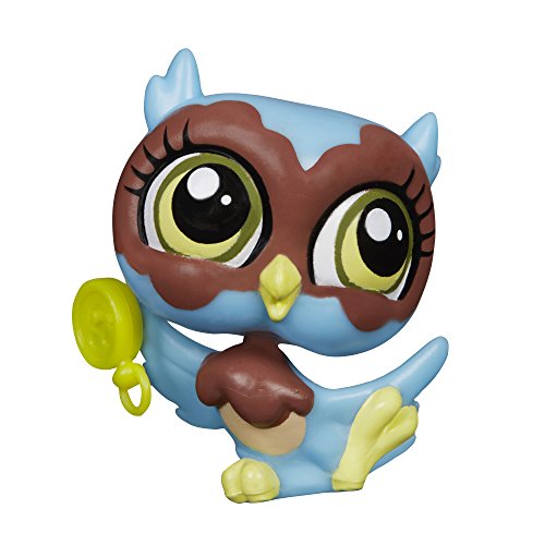 Toy figure of an owl with blue and brown colors on a white background