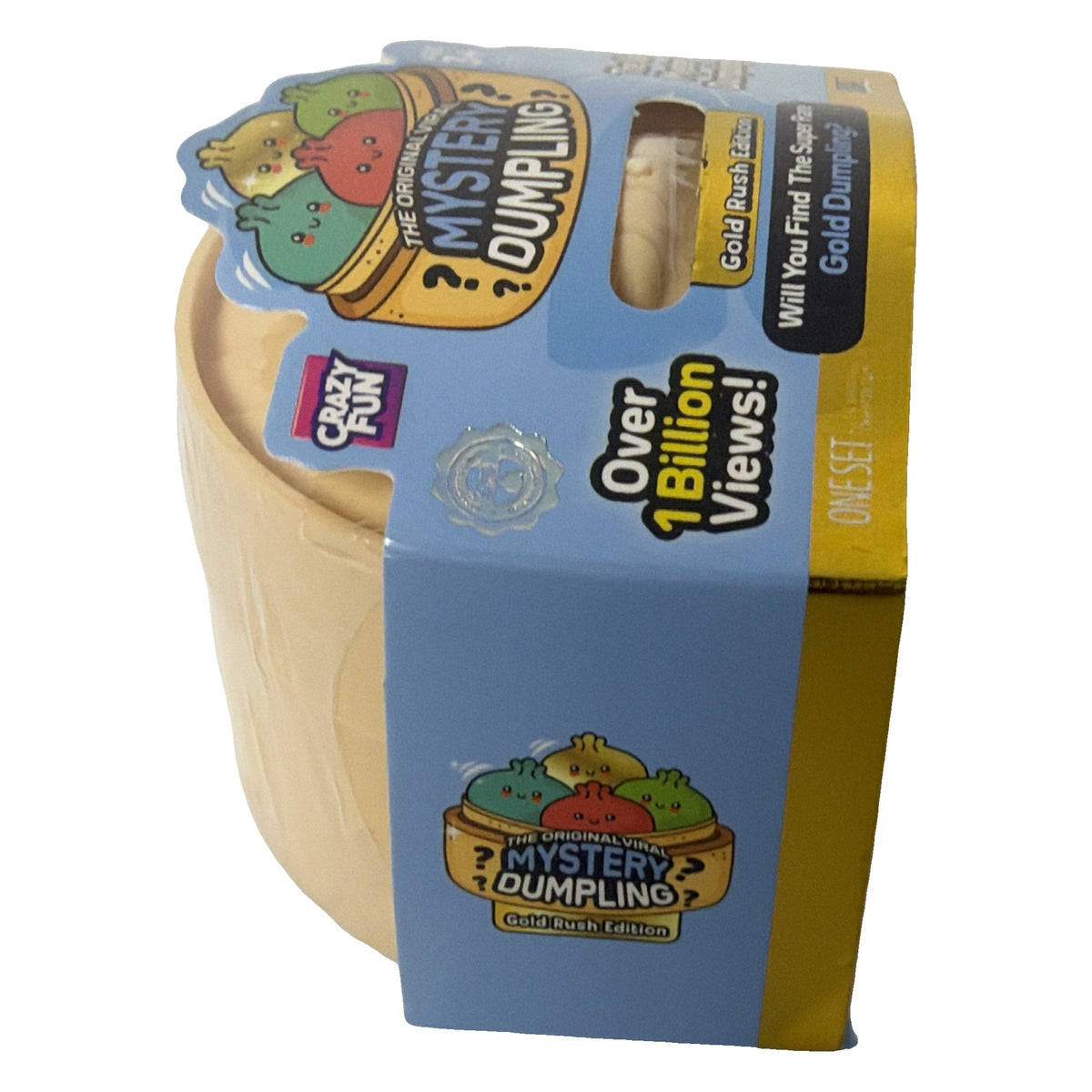 Side view of Crazy Fun Gold Rush Edition mystery dumpling steamer basket package
