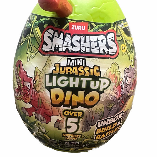 Smashers Mini Jurassic Light Up Dino toy packaging with Zuru branding on a white background