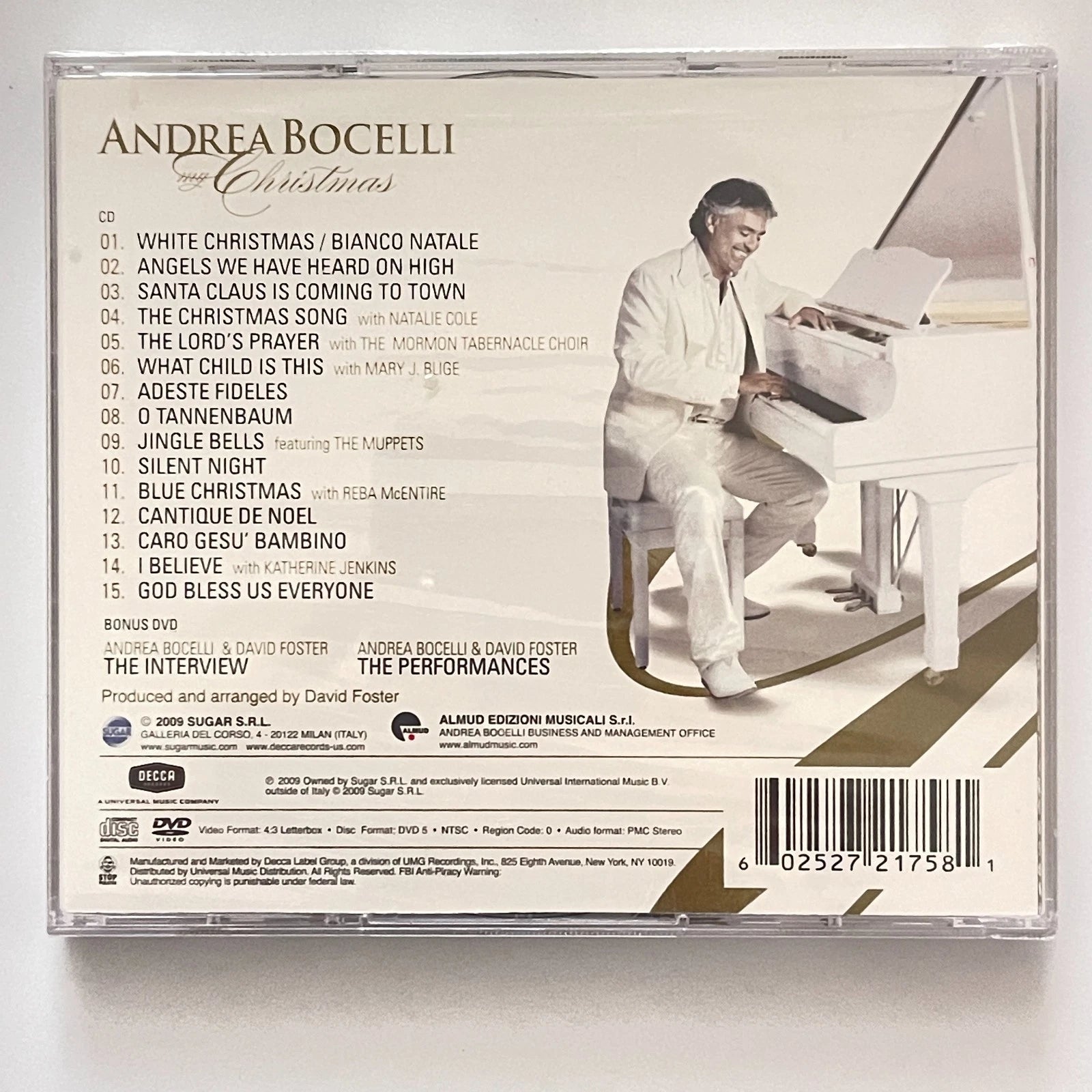 Back cover of Andrea Bocelli's Christmas album with a piano and list of songs.