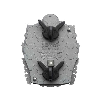 A gray and black Pokémon official pin featuring a textured, scale-like pattern with two black bunny ears on top and bottom, and embossed text reading 'Pokémon Official Pin' and 'C25 Chine / Chine'.