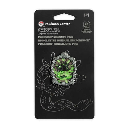Pokémon Center monthly pin in its original black blister packaging, featuring a Zygate green and silver holographic pin.