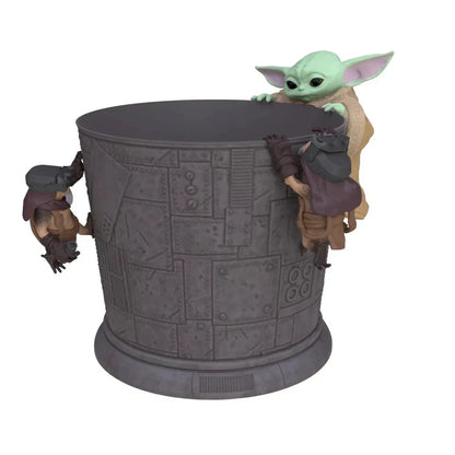 Decorative container with 'Baby Yoda' figurines on a white background