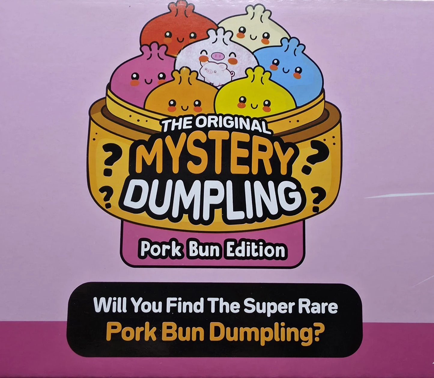 Front of a product box or package for a mystery dumpling set, featuring cartoon dumplings in a steamer basket with the text 'The Original Mystery Dumpling' and 'Pork Bun Edition.' A black banner at the bottom reads, 'Will You Find The Super Rare Pork Bun Dumpling?' The background is a pink-lavender gradient.
