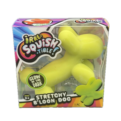A packaged stretchy dog-shaped squishy toy in bright yellow-green, shown inside its colorful retail box. The box reads 'Irre-Squishy Tittle!' and 'Stretchy B'loon Dog,' with a 'Glow in the Dark' badge.