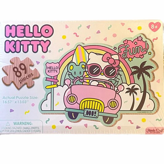 Hello Kitty puzzle packaging with a pink car and rainbow design on a colorful background.