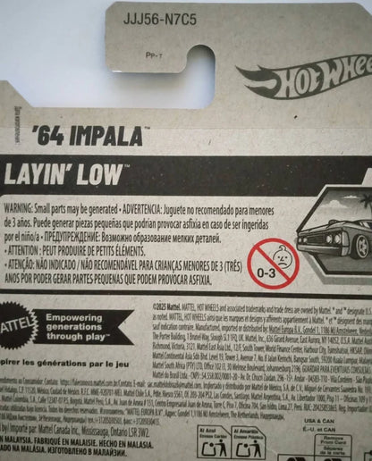 Back packaging of a Mattel Hot Wheels '64 Impala Layin' Low toy car, showing product details, warning labels, and the Hot Wheels logo.