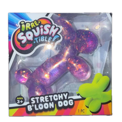 A packaged pet toy shaped like a balloon dog, shown in its retail box. The toy is translucent and filled with purple, pink, and orange glitter.